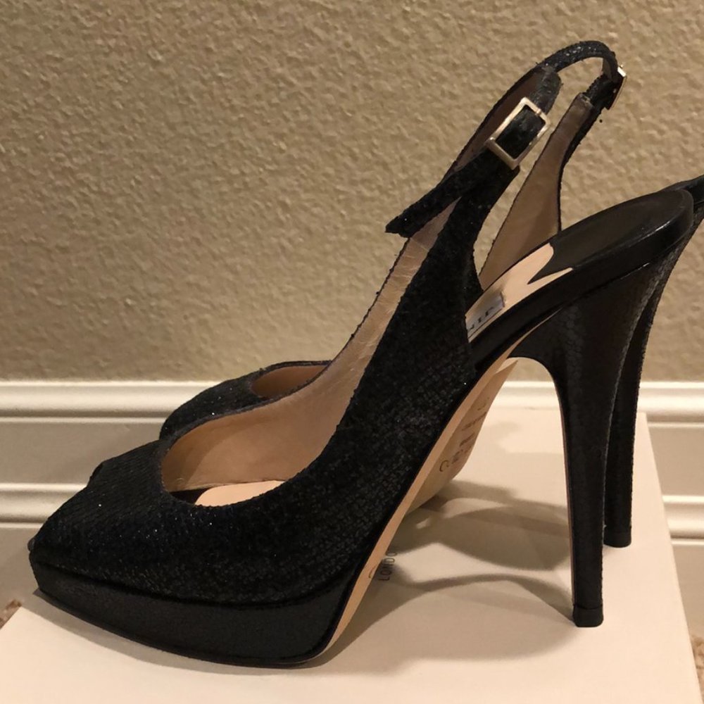 Jimmy Choo “black glitter” strappy peep toe. Just in time for the HOLIDAYS